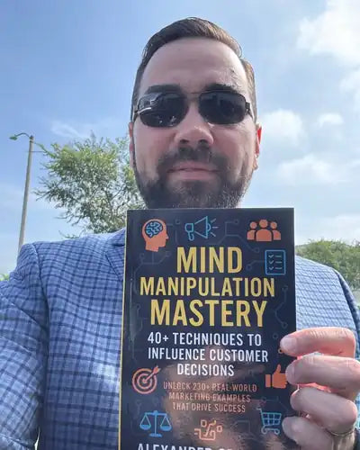 Author holding Mind Manipulation Mastery