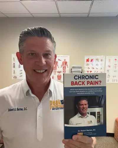 Author holding Chronic Back Pain?