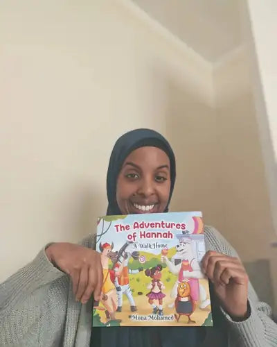 Author holding The Adventures of Hannah