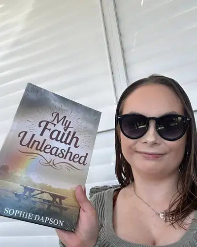 Author holding My Faith Unleashed